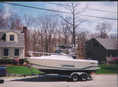 Atlantic Towers Arch installed on a Seaswirl 2150 Striper walkaround boat docked at the marina.