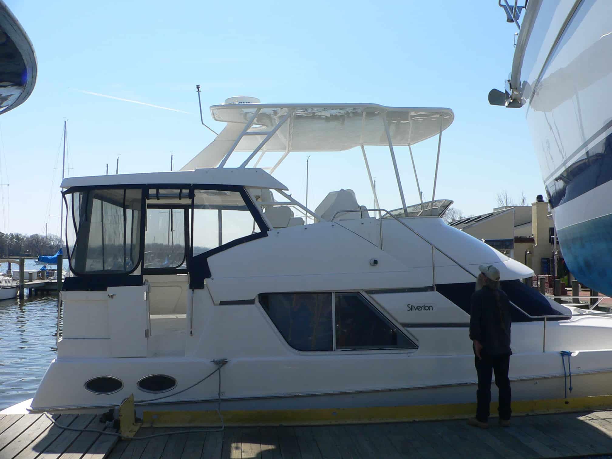 Atlantic Towers Top installed on a Silverton 372/392 Motor Yacht at a marina, with a person nearby.