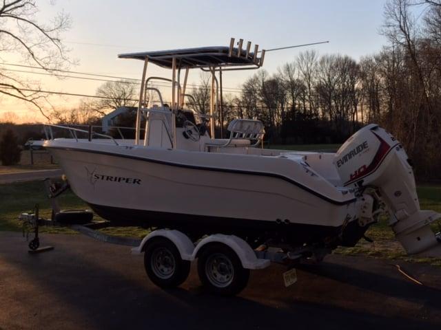 Atlantic Towers T-Top installed on a Seaswirl boat, parked on a trailer during sunset.