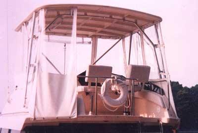 Atlantic Towers Top installed on a Silverton 34 Convertible boat, featuring a canvas enclosure and seating area.