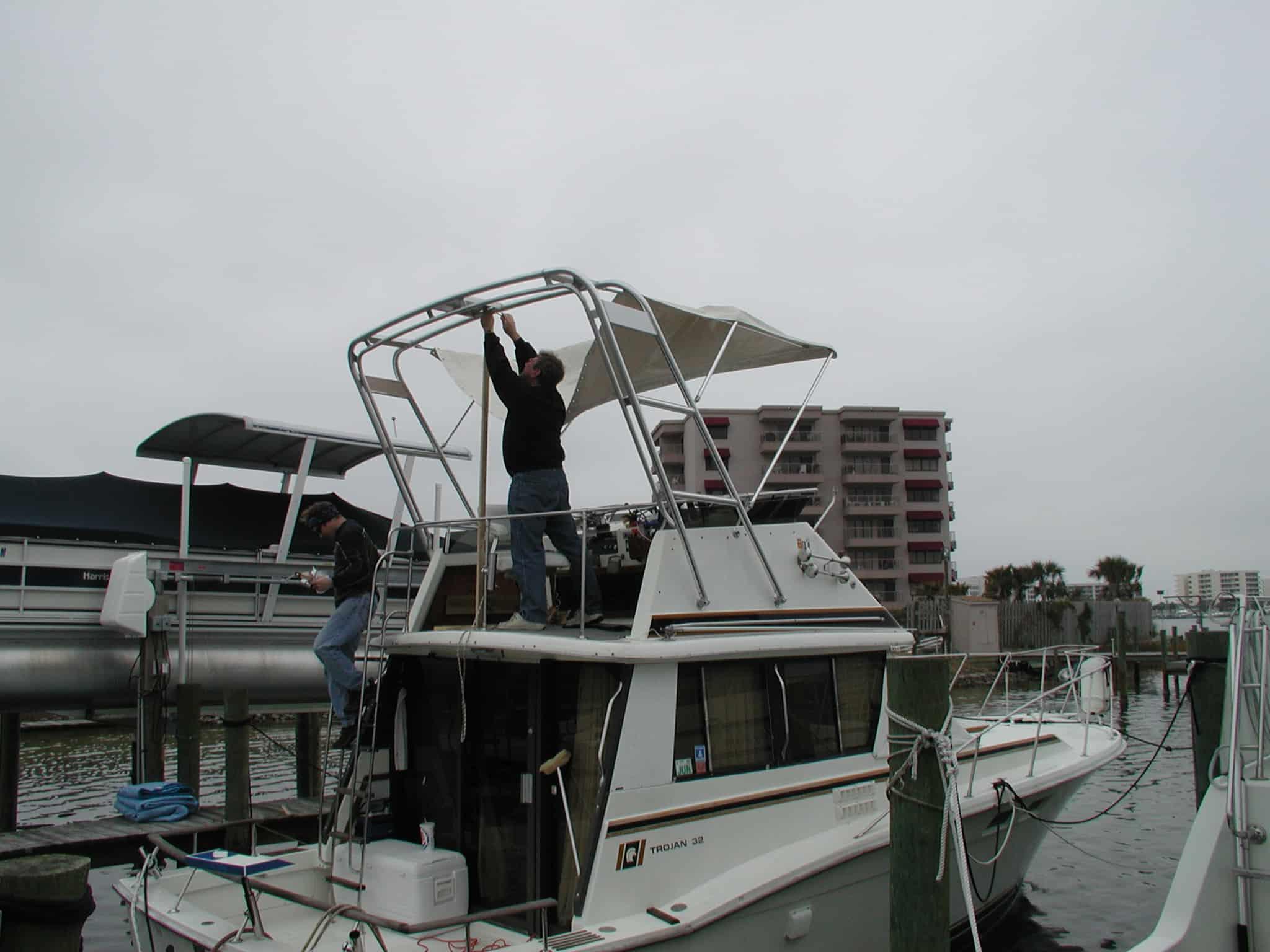 Atlantic Towers arch installed on a Trojan F32 sedan boat, showcasing its sleek design and functionality.