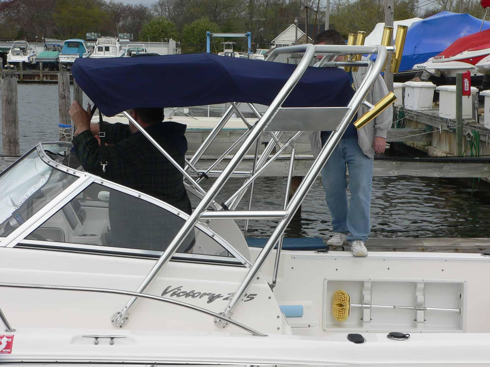 Atlantic Towers Arch installed on a Sea Hunt 225 Victory walkaround boat, showing side and rear view
