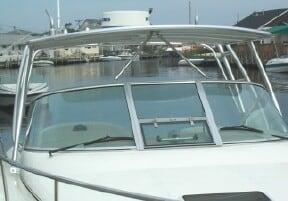 Atlantic Towers Top installed on the windshield frame of a Sea Ray 290 Amberjack boat docked in a marina.