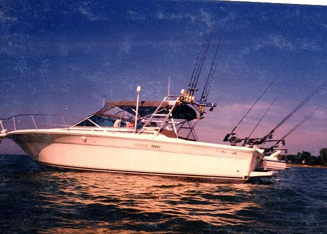 Atlantic Towers arch on a Sea Ray 310 Amberjack express cruiser in a marina setting.